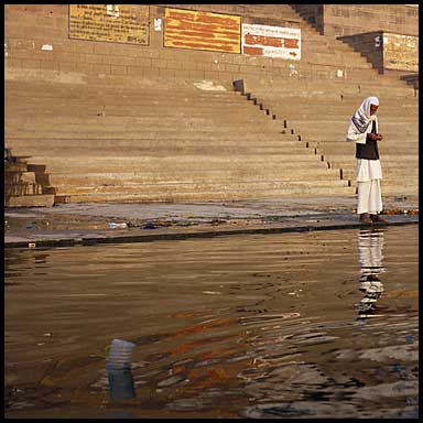 man at ganges and bottle 25202 bytes
