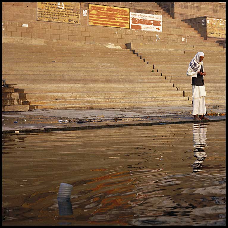 man at ganges and bottle
